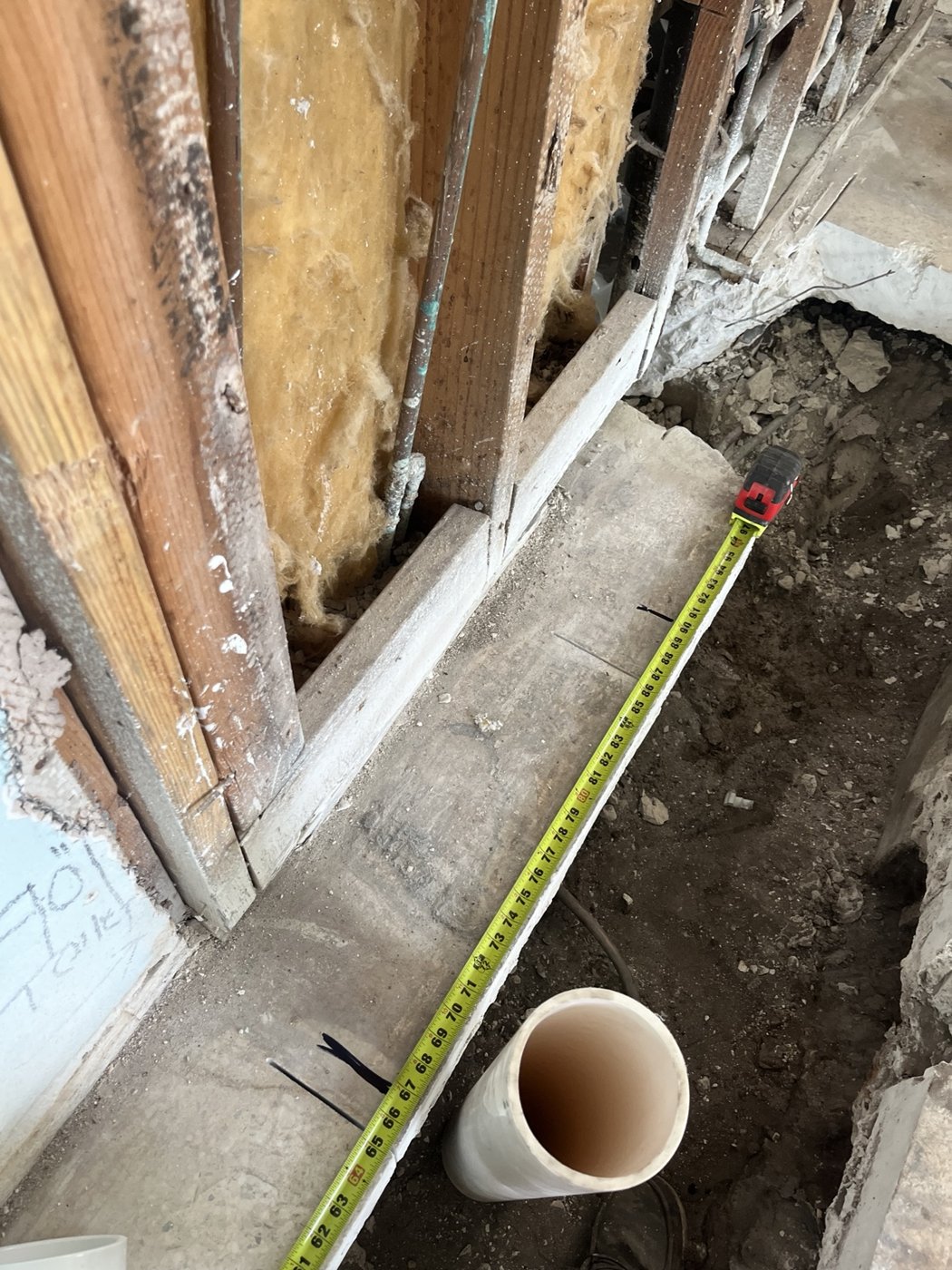 Plumbing pipework exposed during renovation