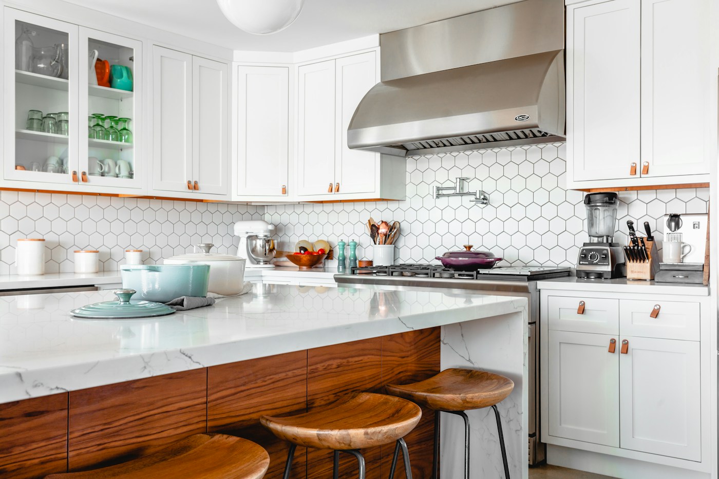 Finished white kitchen with marble island and installed appliances; design inspiration